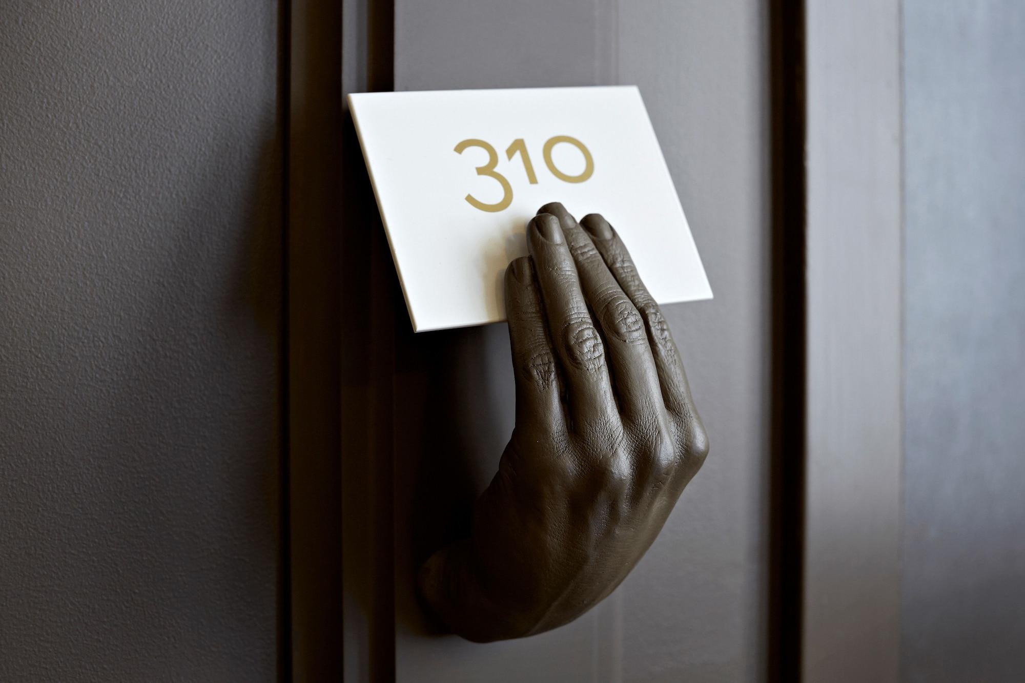Qt Sydney Hotel Exterior photo The hand sculpture